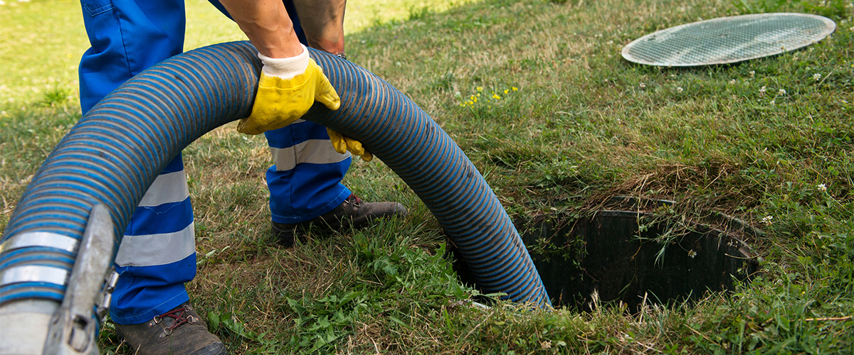 service man emptying septic tank
